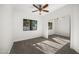Bedroom with mirrored closet doors and a ceiling fan at 12286 N 86Th Pl, Scottsdale, AZ 85260