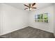 Bright bedroom featuring a ceiling fan and neutral carpeting at 12286 N 86Th Pl, Scottsdale, AZ 85260