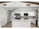 Modern kitchen with white cabinets, stainless steel appliances, and quartz countertops at 12286 N 86Th Pl, Scottsdale, AZ 85260