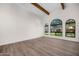 Living room featuring hardwood floors, high ceilings and large windows at 12286 N 86Th Pl, Scottsdale, AZ 85260