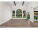 Living room with hardwood floors, high ceilings, and large windows at 12286 N 86Th Pl, Scottsdale, AZ 85260