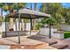 Outdoor patio area with built-in BBQ and gazebo at 12286 N 86Th Pl, Scottsdale, AZ 85260