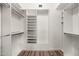 Large walk-in closet with ample shelving and hanging space at 12286 N 86Th Pl, Scottsdale, AZ 85260