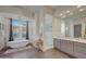 Elegant bathroom with double vanity and a free-standing tub at 12411 N 133Rd Pl, Scottsdale, AZ 85259