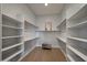 Large walk-in closet with ample shelving and hanging space at 12411 N 133Rd Pl, Scottsdale, AZ 85259