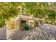 Sunny backyard with paved patio and mature trees providing shade at 12465 N 71St Ave, Peoria, AZ 85381