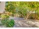 Landscaped backyard with pergola and paved patio at 12465 N 71St Ave, Peoria, AZ 85381