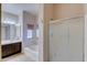 Bathroom with shower, tub, and dark brown vanity at 12465 N 71St Ave, Peoria, AZ 85381