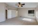 Primary bedroom with ceiling fan and access to bathroom at 12465 N 71St Ave, Peoria, AZ 85381