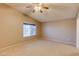 Bedroom with ceiling fan and window at 12465 N 71St Ave, Peoria, AZ 85381
