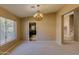 Dining area with chandelier and view into kitchen at 12465 N 71St Ave, Peoria, AZ 85381