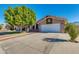 Two-story house with a large tree and driveway at 12465 N 71St Ave, Peoria, AZ 85381
