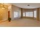 Bright living room with large windows and carpeted floor at 12465 N 71St Ave, Peoria, AZ 85381