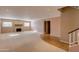 Spacious living room featuring a brick fireplace and tile flooring at 12465 N 71St Ave, Peoria, AZ 85381