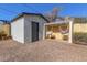 Backyard with shed, gravel, and hanging chairs at 13136 N 20Th Ln, Phoenix, AZ 85029