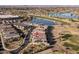 Aerial view of home and community near lake and golf at 13616 W Sandridge Dr, Sun City West, AZ 85375