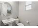 Small bathroom with pedestal sink and toilet at 13616 W Sandridge Dr, Sun City West, AZ 85375