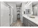 Modern bathroom with double vanity and walk-in shower at 13616 W Sandridge Dr, Sun City West, AZ 85375