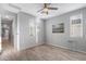 Bedroom with wood-look floors and ceiling fan at 13616 W Sandridge Dr, Sun City West, AZ 85375