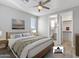 Virtually staged bedroom with ensuite bathroom and closet at 13616 W Sandridge Dr, Sun City West, AZ 85375