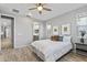 Charming bedroom with ensuite bathroom and hardwood floors at 13616 W Sandridge Dr, Sun City West, AZ 85375