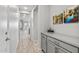 Bright hallway with built-in storage and hardwood floors at 13616 W Sandridge Dr, Sun City West, AZ 85375