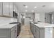 Modern kitchen with gray cabinets and island at 13616 W Sandridge Dr, Sun City West, AZ 85375