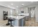 Modern kitchen with gray cabinets, white countertops and breakfast bar at 13616 W Sandridge Dr, Sun City West, AZ 85375