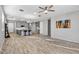 Open concept living room with kitchen island and hardwood floors at 13616 W Sandridge Dr, Sun City West, AZ 85375