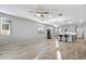 Spacious living room featuring hardwood floors and an open floor plan at 13616 W Sandridge Dr, Sun City West, AZ 85375