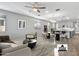 Bright living room with hardwood floors and modern furniture at 13616 W Sandridge Dr, Sun City West, AZ 85375
