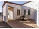 Brick patio with a small table and chairs, adjacent to the home at 13616 W Sandridge Dr, Sun City West, AZ 85375