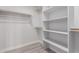 Spacious closet with ample shelving and hanging rods at 13903 W Gable Hill Dr, Sun City West, AZ 85375