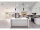 Modern kitchen with white cabinets, quartz countertops, and stainless steel appliances at 13903 W Gable Hill Dr, Sun City West, AZ 85375