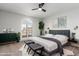 Serene main bedroom featuring a comfortable bed and ample natural light at 13903 W Gable Hill Dr, Sun City West, AZ 85375