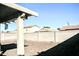 Private backyard with covered patio and gravel landscaping at 13915 N 132Nd Ln, Surprise, AZ 85379