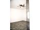 Spacious bedroom with ceiling fan and gray wood-look floors at 13915 N 132Nd Ln, Surprise, AZ 85379