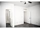 Bright bedroom with ceiling fan and access to bathroom at 13915 N 132Nd Ln, Surprise, AZ 85379
