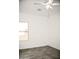 Bright bedroom with ceiling fan and large window at 13915 N 132Nd Ln, Surprise, AZ 85379