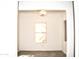 Simple dining room featuring a chandelier and large window at 13915 N 132Nd Ln, Surprise, AZ 85379