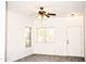 Bright living room with ceiling fan and wood-look floors at 13915 N 132Nd Ln, Surprise, AZ 85379