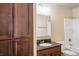 Bathroom with granite countertop and a shower/tub combo at 14145 N 92Nd St # 1052, Scottsdale, AZ 85260