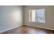 Bedroom with wood floors and a window with blinds at 14145 N 92Nd St # 1052, Scottsdale, AZ 85260
