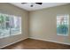 Bright bedroom with wood floors and large windows at 14145 N 92Nd St # 1052, Scottsdale, AZ 85260