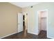 Bedroom with wood floors and access to closet and kitchen at 14145 N 92Nd St # 1052, Scottsdale, AZ 85260