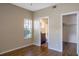 Bedroom with wood floors, access to bathroom and closet at 14145 N 92Nd St # 1052, Scottsdale, AZ 85260