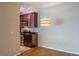Dining area with hardwood floors and kitchen view at 14145 N 92Nd St # 1052, Scottsdale, AZ 85260