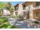 Exterior view of an apartment building with stairs and landscaping at 14145 N 92Nd St # 1052, Scottsdale, AZ 85260