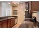 Kitchen with stainless steel appliances and dark wood cabinets at 14145 N 92Nd St # 1052, Scottsdale, AZ 85260