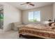 Bright bedroom with a queen-size bed and access to a balcony at 14815 N Fountain Hills Blvd # 201, Fountain Hills, AZ 85268